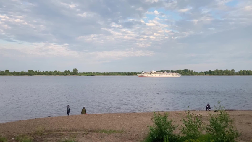River landscape with white ship. Blue sky, summer. River Kama, Perm, Russia