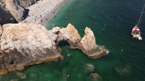 Skiathos, Greece - Aug. 7, 2021. Aerial shot of Lalaria Beach at the Aegean Sea island of Skiathos.