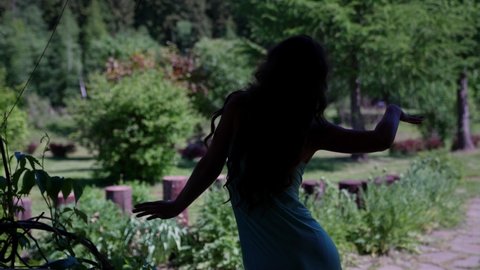 silhouette a woman intuitively dances in nature an emotional state of trance in movements