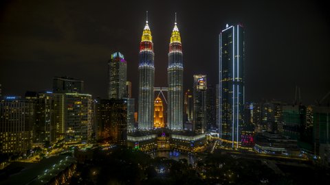 Kuala Lumpur, Malaysia- August 30, 2020: Time lapse of Kuala Lumpur city Petronas Twin Tower light color of Malaysia flag. 