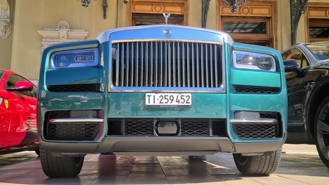 Monte-Carlo, Monaco - August 5, 2021: 8K Green Rolls-Royce Cullinan Luxury SUV Car Parked In Front Of The Monte-Carlo Casino In Monaco On The French Riviera, Europe. Close Up Front View - 8K UHD