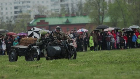 German soldiers ride motorcycle with sidecar and machine gun MG 42 during reconstruction of invasion to USSR Soviet Union 22 June 1941 at World War 2. Great Patriotic War. BOBRUISK, BELARUS MAY 9 2021