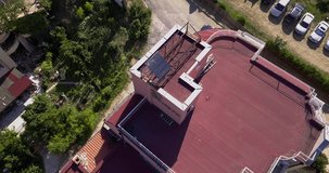 Drone Circling video of the red roof with solar panels, south of Bulgaria. Alternative energy concept.