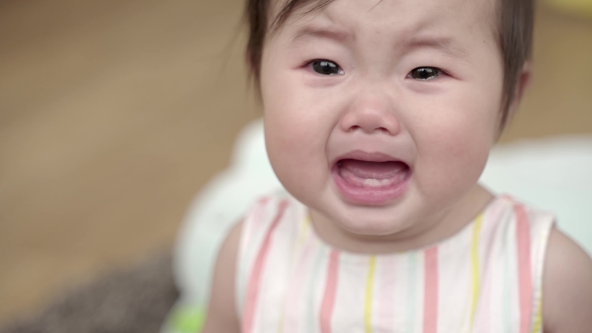 closeup of asian baby crying  Royalty-Free Stock Footage #1077152210