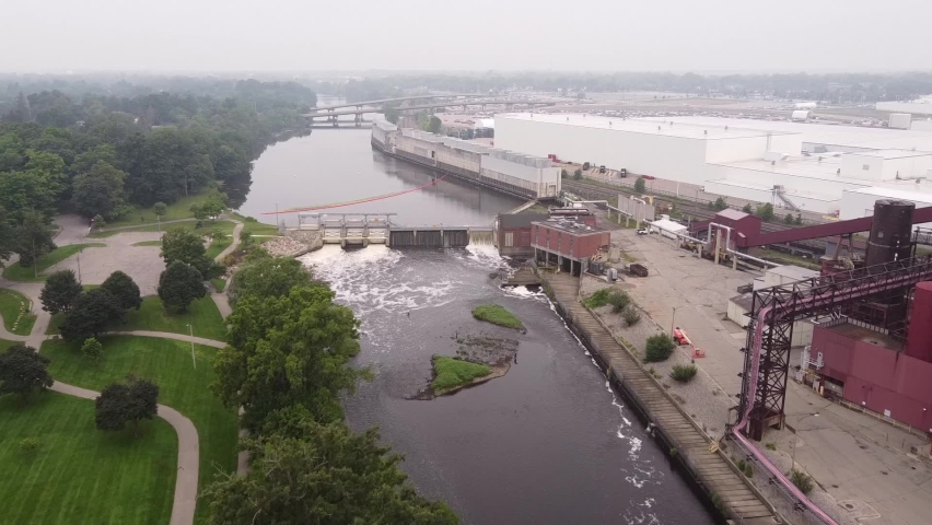 Dam Water Flowing On Grand River Near Otto C. Eckert Municipal Power Plant In Lansing, Michigan. aerial