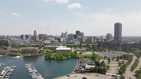 Buffalo, New York skyline with marina drone video moving up.