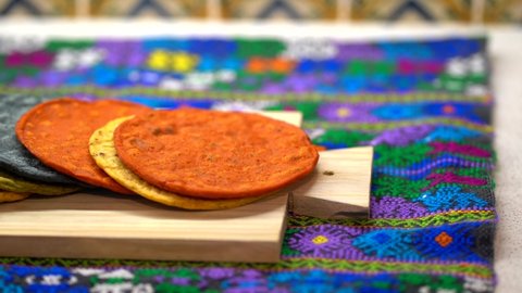 Tortillas of different maize. Multicolored tortillas. Guatemalan tortillas with typical tablecloth from guatemala