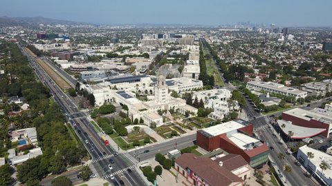 Aerial View, Beverly Hills, California USA. Street Traffic, City Hall, Buildings and Downtown Los Angeles in Skyline, Pedestal Drone Shot