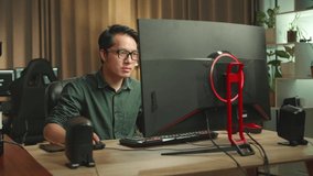 Frustrated Asian Man Works On Personal Computer And 3D Printer In Home Office, He Works At Night 
 - Powered by Shutterstock - Get 15% off with code: PIKWIZARD15