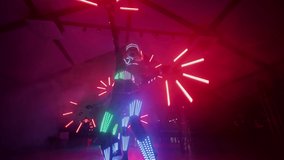 LED show in a nightclub. Impressive dances of young people glowing in the dark with Led illumination. Laser show. - Powered by Shutterstock - Get 15% off with code: PIKWIZARD15