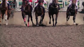 Start of the Horse Racing. The Horses with the Jockeys at the Racetrack Raising Dust and Dirt. Close Up. Slow motion. - Powered by Shutterstock - Get 15% off with code: PIKWIZARD15