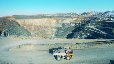 Loaded truck on the road of an open-pit mine