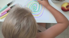 Top view of girl drawing with felt-tip pens. Education, home schooling concept