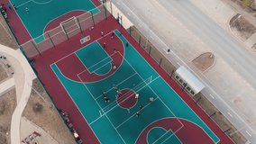 A video was shot from a great height from a drone. The video shows a versatile outdoor sports complex for any climate, for a great way to physically develop and keep fit for children.