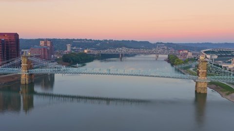 Aerial: Purple People Bridge crossing the Ohio River at sunrise, Ohio, USA.