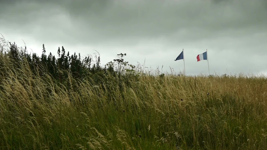 National flags at D Day Beach at Arromanches, France