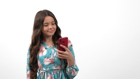 happy child making selfie on smartphone with peace gesture and texting message, modern communication