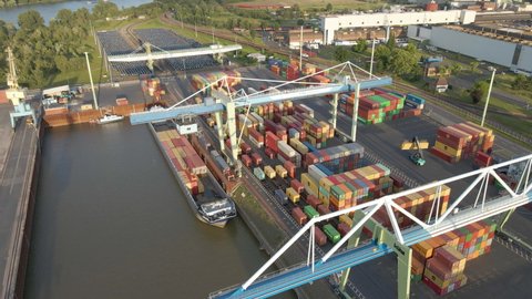 High angle view of container dock with container handler placing container on site