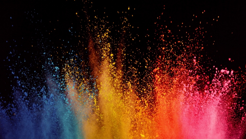 Super slow motion of colored powder explosion isolated on black background. Filmed on high speed cinema camera.