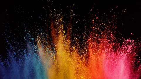 Super slow motion of colored powder explosion isolated on black background. Filmed on high speed cinema camera.