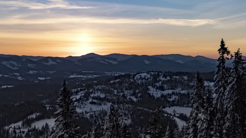 Sunrise winter mountain beautiful down landscape with a wide view, UHD 4K timelapse