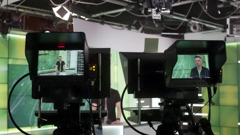 News Studio Anchor Reporting on the Events of the Day. TV Broadcasting Channel. TV studio backstage video recording news