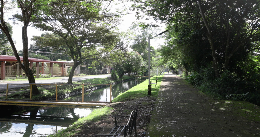 Panama Dolega, riverbanks of artificial canal and footpath