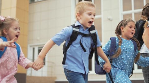 Child run to school with backpack. Back to school. Happy child run with backpack. School education. Child learning after lockdown. Happy family run through schoolyard. Joy of learning. Child to school