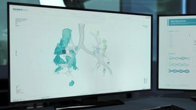 Computer Screens shows a Biotechnology software running. Biotechnology software is Analyzing the 3D Projection of the Patient`s Lungs. Biotechnology software has Identified Covid-19 Cells. Medicine. - Powered by Shutterstock - Get 15% off with code: PIKWIZARD15