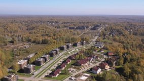 Aerial video of village Gorky Akademparka. Beautiful autumn country landscape from above. Novosibirsk, Siberia, Russia.