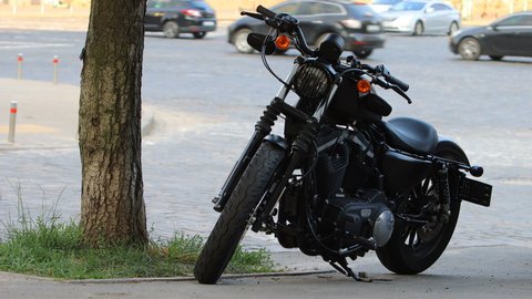KIEV, UKRAINE, JULY 13, 2021. Black stylish Harley Davidson motorbike at street side.