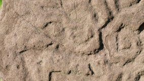 Video of ancient petroglyphs on stone.
