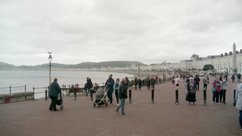8th August 2021, Llandudno, Wales UK. crouds walking on the pier and promenade.