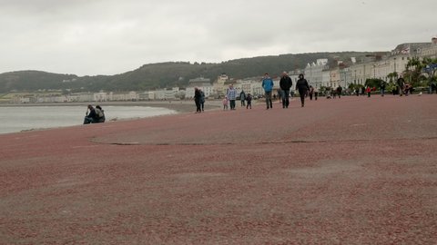 8th August 2021, Llandudno, Wales UK. crouds walking on the pier and promenade.