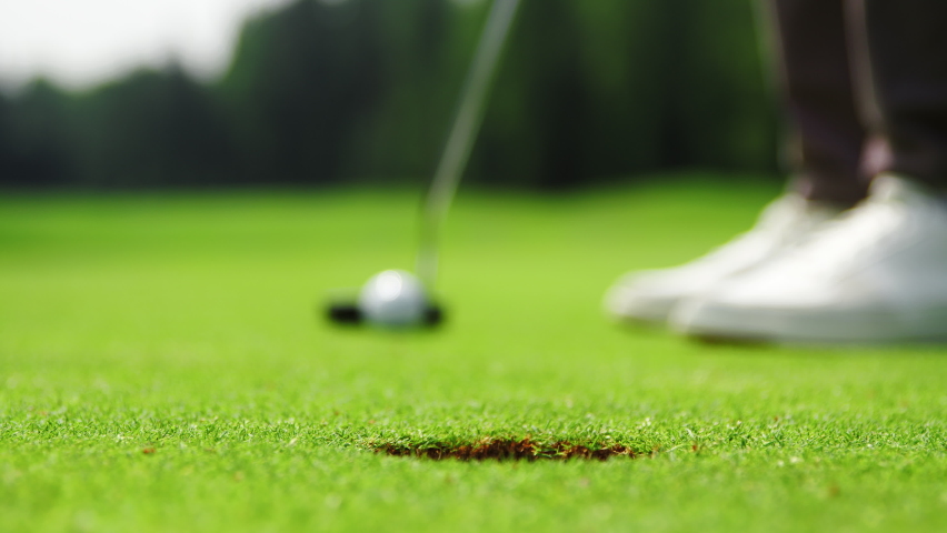 Golf player hitting a golf ball Royalty-Free Stock Footage #1077269819