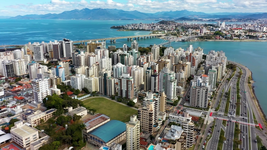 Florianopolis, Brazil. Aerial landscape of landmark avenue and buldings of downtown city of Florianopolis, state of Santa Catarina, Brazil.  Aerial landscape of island of Florianopolis, Brazil. Royalty-Free Stock Footage #1077271901