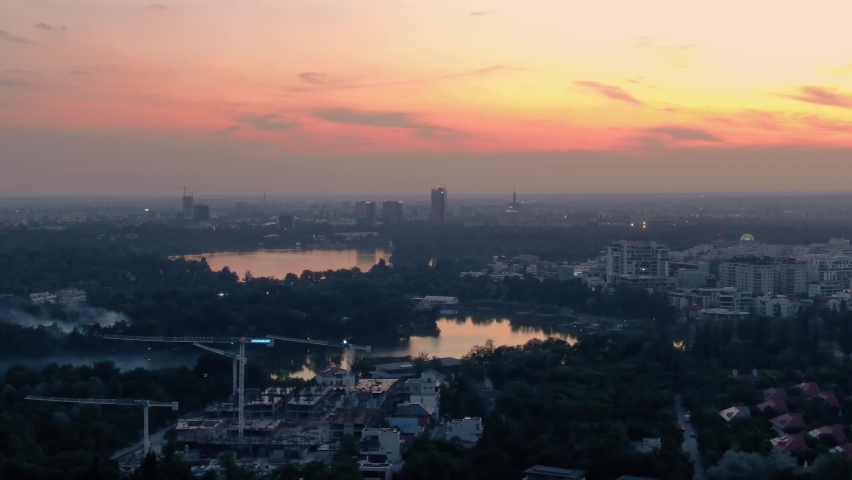 Aerial Drone Helicopter Panoramic View Of Bucharest City Skyline Business District At Sunset Royalty-Free Stock Footage #1077274580