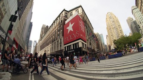 New York NY USA-August 7, 2021 Crowds of shoppers in Herald Square in front of Macys.