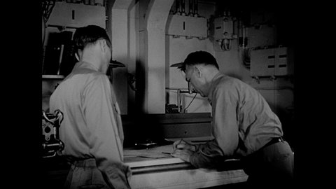 1940s: Officers plot naval course on map of the Pacific Ocean. Hand traces line to the Philippine Islands on map. Soldier points to map of Philippines and talks.