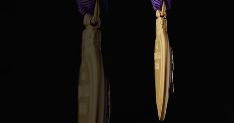CALIFORNIA, UNITED STATES – August 8, 2021: Stock footage of Purple Heart Medal for military merit on dark background.