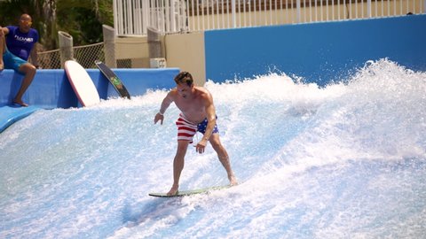 HOLLYWOOD, FL, USA - AUGUST 7, 2021: Man falls at the wave pool 4k video