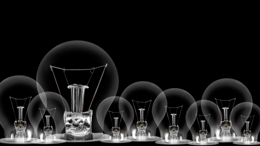 Light bulbs going from dark to light with Education, Knowledge, Ability, Competence, Skill and Development fiber text on black background. High quality 4k video. Royalty-Free Stock Footage #1077318293