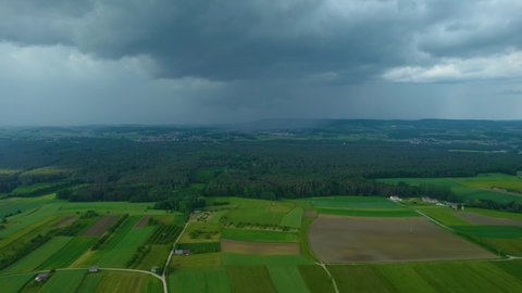 Aerial view around the village Roeckenhof in Germany, on a cloudy day with thunder clouds in spring.