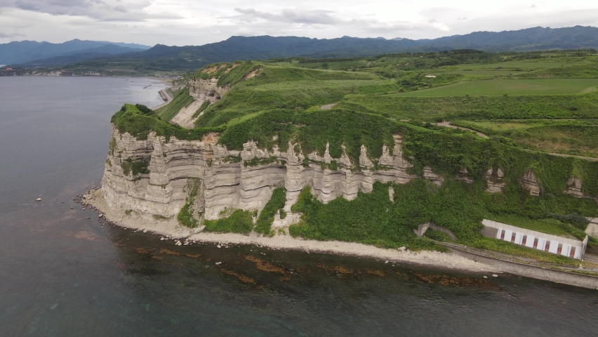 An aerial view of a cape with a series of chalky sea cliffs, which the locals call the "Grand Canyon of the East".
