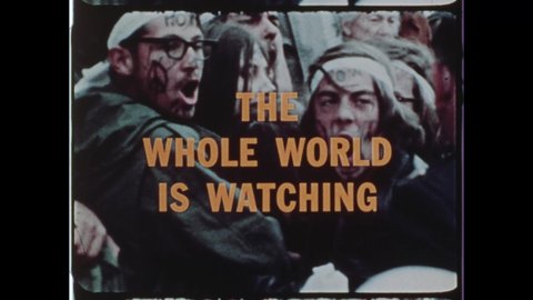 1971 Washington, DC. Hippie Protestors Chat "The Whole World is Watching" during Mayday Protest. Yellow Letters burn on Freeze Frame for Title Sequence. 4K Overscan of Vintage Archival 16mm Film Print