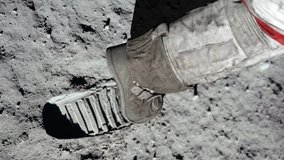 Lunar astronaut walking on the moon's surface and leaves a footprint in the lunar soil. 3d rendering. Some Elements of this video furnished by NASA. - Powered by Shutterstock - Get 15% off with code: PIKWIZARD15