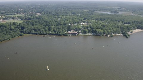 Drone Aerial views of Lac Léon in the french Aquitaine area. The Lake Leon is a famous travel destination for camping on the atlantic coast. Lake Leon is between Biarritz, Bayonne and Bordeaux.