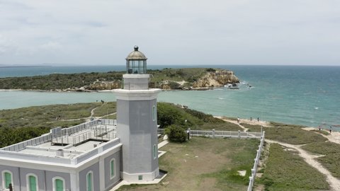 Close fly-past over the gallery of the Faro Morrillos de Cabo Rojo in Puerto Rico looking out over the Caribbean