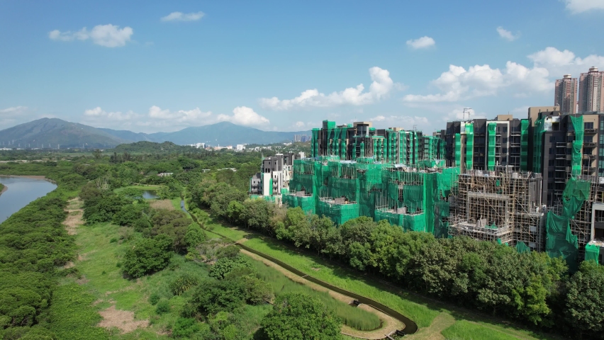Aerial view of Hong Kong Wetland Park, Tin Shui Wai, New Territories, Hong Kong, A Rural Land Town Development Residential Housing Property Construction Project near an ecological mitigation Marsh, an Industrial Video by BSSW