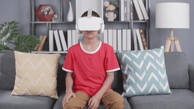 asian boy wearing virtual reality googles at home, remote education experiment, future today, new online education, indoor lifestyle.